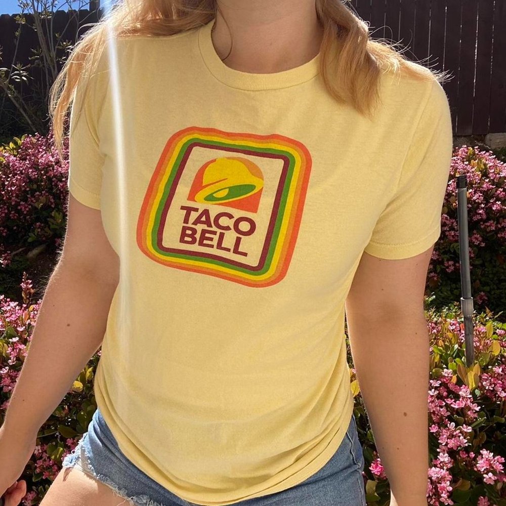 Vintage Yellow Taco Bell graphic short-sleeve top.